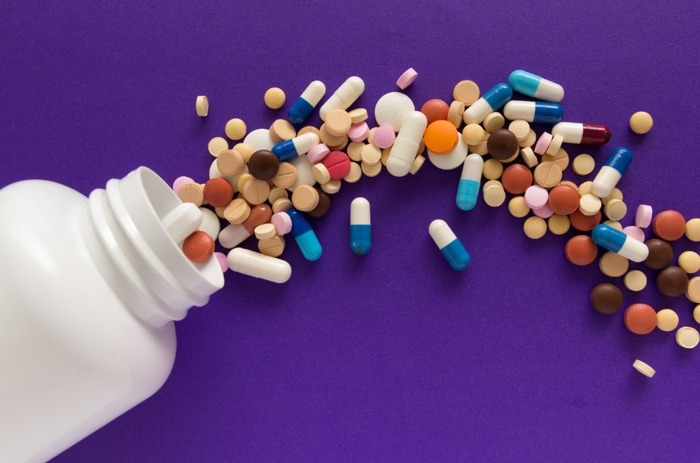 Pharmacist comparing generic and brand-name medicine packaging